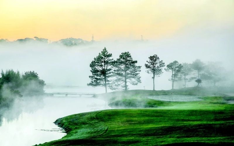 Golf course in Da Lat in the misty morning