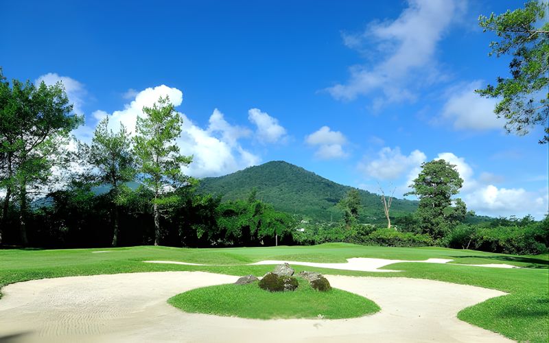 Scenic fairway at Handara Golf Resort Bali nestled among tropical hills.