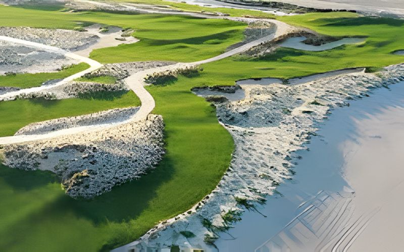 Scenic coastal golf course at Hoiana Shores Golf Club surrounded by sand dunes and sea breeze.