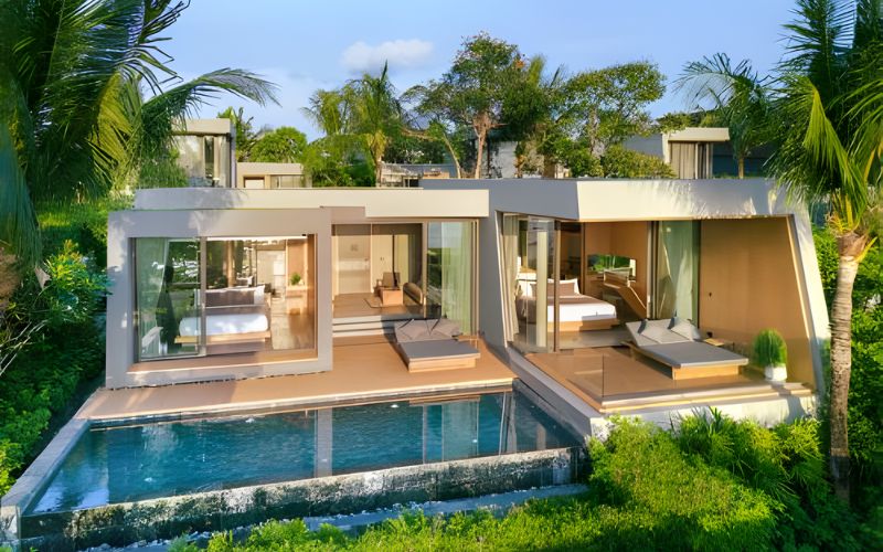 Modern luxury villa at MASON Pattaya featuring a private pool, tropical landscaping, and contemporary architecture under clear blue skies.