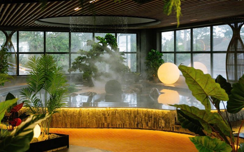 Suoi May Onsen Dalat in Vietnam featuring indoor hot spring pools, lush tropical greenery, and a relaxing spa atmosphere