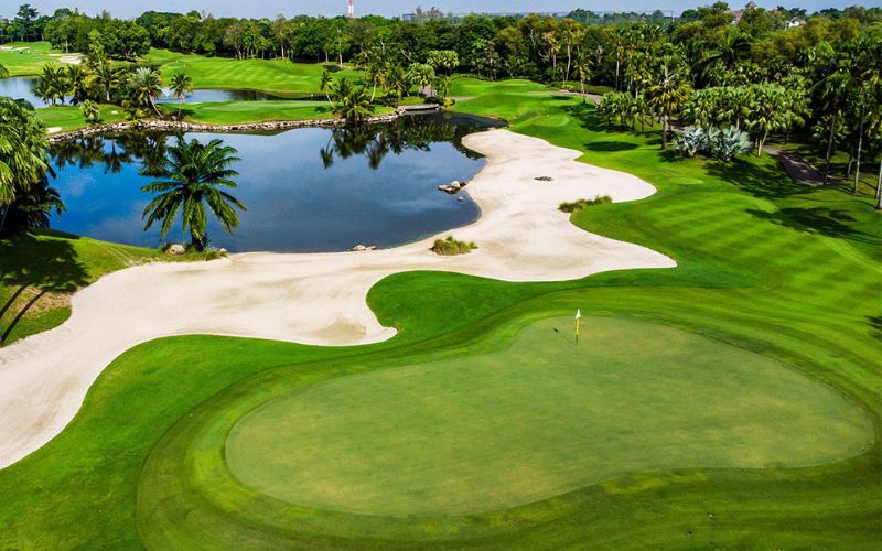 Alpine Golf Sports Club Thailand showcasing championship fairways, pristine greens, white sand bunkers, scenic water hazards, and lush tropical landscaping.