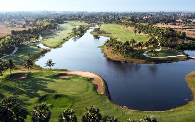 Phokeethra Country Club Cambodia showcasing scenic fairways, sparkling water hazards, pristine bunkers, and a championship golf course surrounded by tropical landscapes.