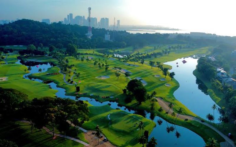 Sentosa Golf Club Singapore showcasing championship golf fairways, scenic lakes, tropical greenery, and panoramic views of the Singapore skyline.