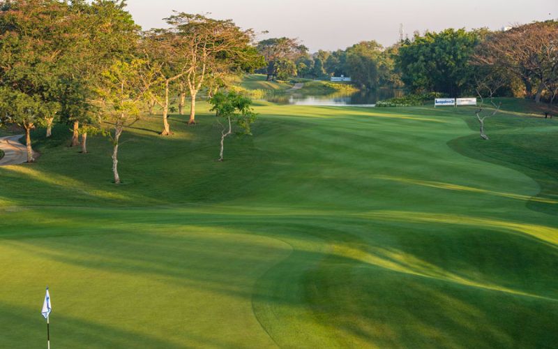 Yangon Golf Club Myanmar featuring tree-lined fairways, well-maintained greens, rolling landscape, and a peaceful parkland golf course setting.