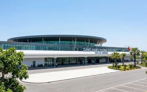 Exterior view of Quy Nhon airport terminal building under a clear blue sky.