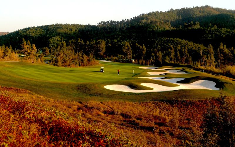 b fairway with sand bunkers and rolling hills in Yunnan